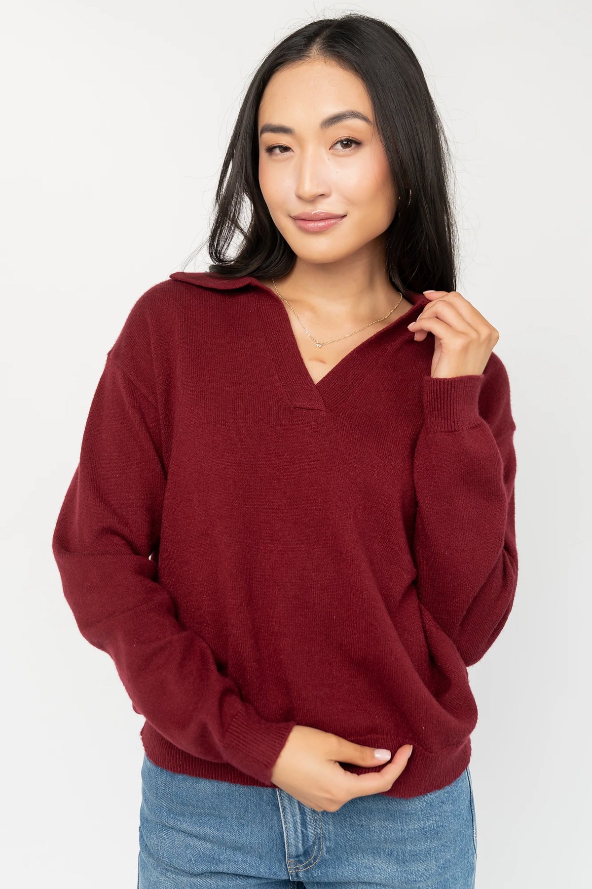 Bodhi Sweater with open rugby-style collar, dropped shoulders, long sleeves, and ribbed cuffs and hem.