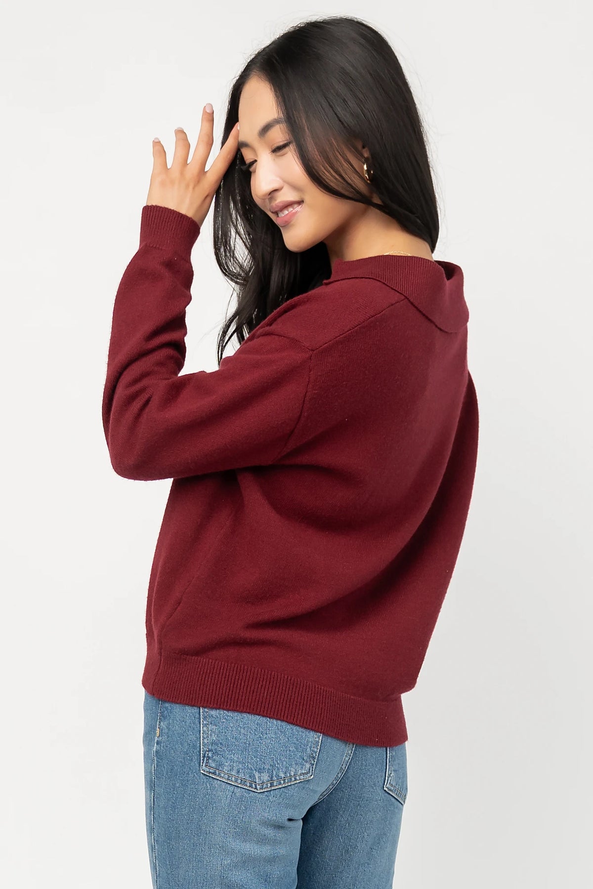 Bodhi Sweater with open rugby-style collar, dropped shoulders, long sleeves, and ribbed cuffs and hem.