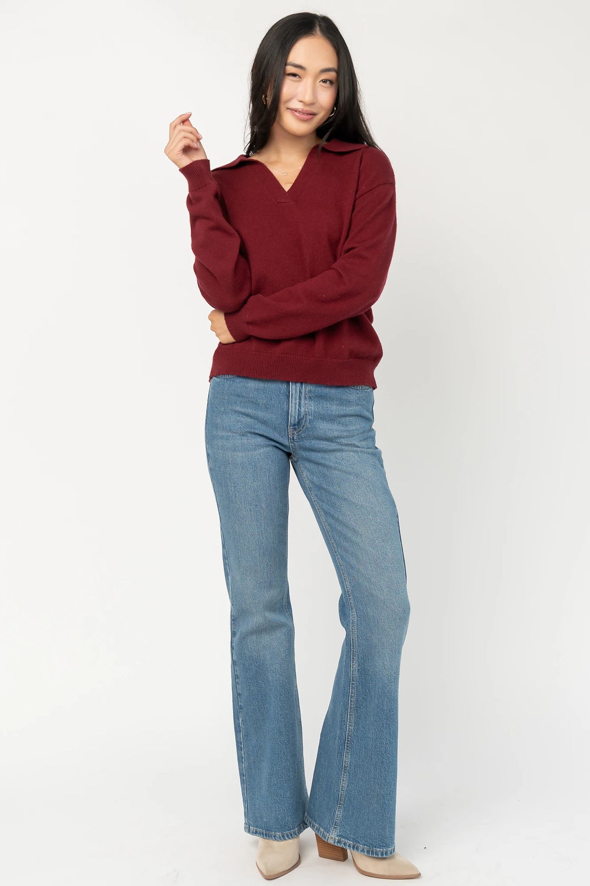 Bodhi Sweater with open rugby-style collar, dropped shoulders, long sleeves, and ribbed cuffs and hem.