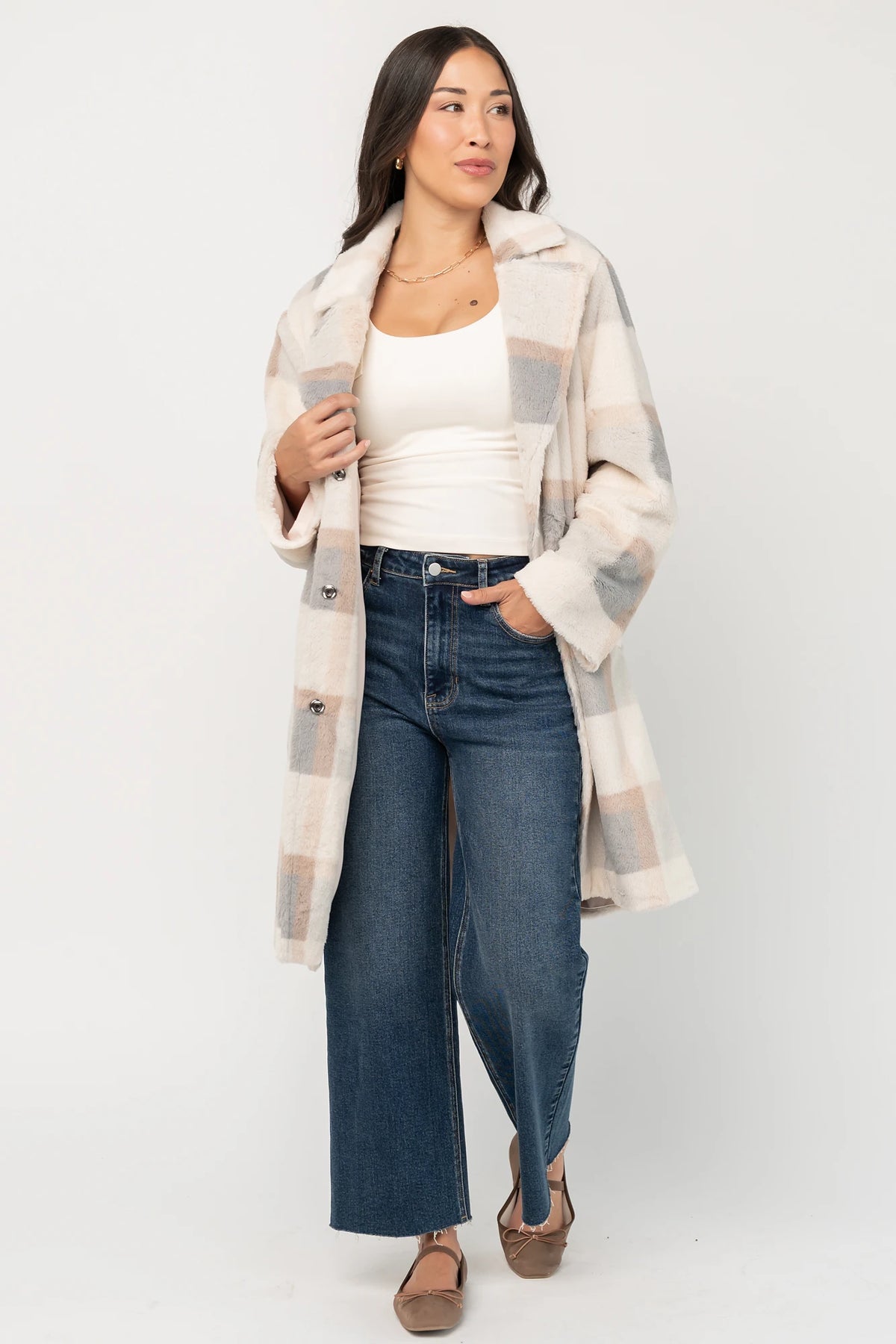 Natural plaid faux fur mid-length coat with taupe and gray accents, notched collar, hidden front snap closure, long sleeves, functional side pockets, and a fully lined interior.