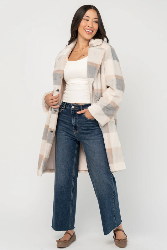 Natural plaid faux fur mid-length coat with taupe and gray accents, notched collar, hidden front snap closure, long sleeves, functional side pockets, and a fully lined interior.