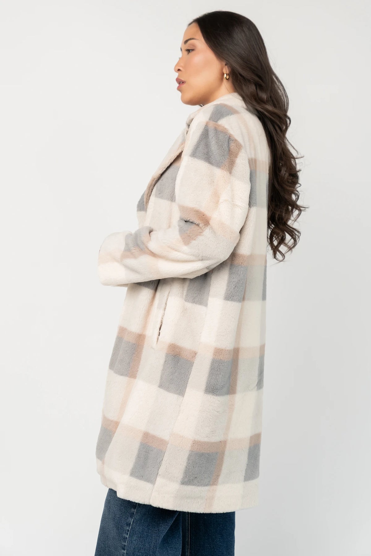 Natural plaid faux fur mid-length coat with taupe and gray accents, notched collar, hidden front snap closure, long sleeves, functional side pockets, and a fully lined interior.