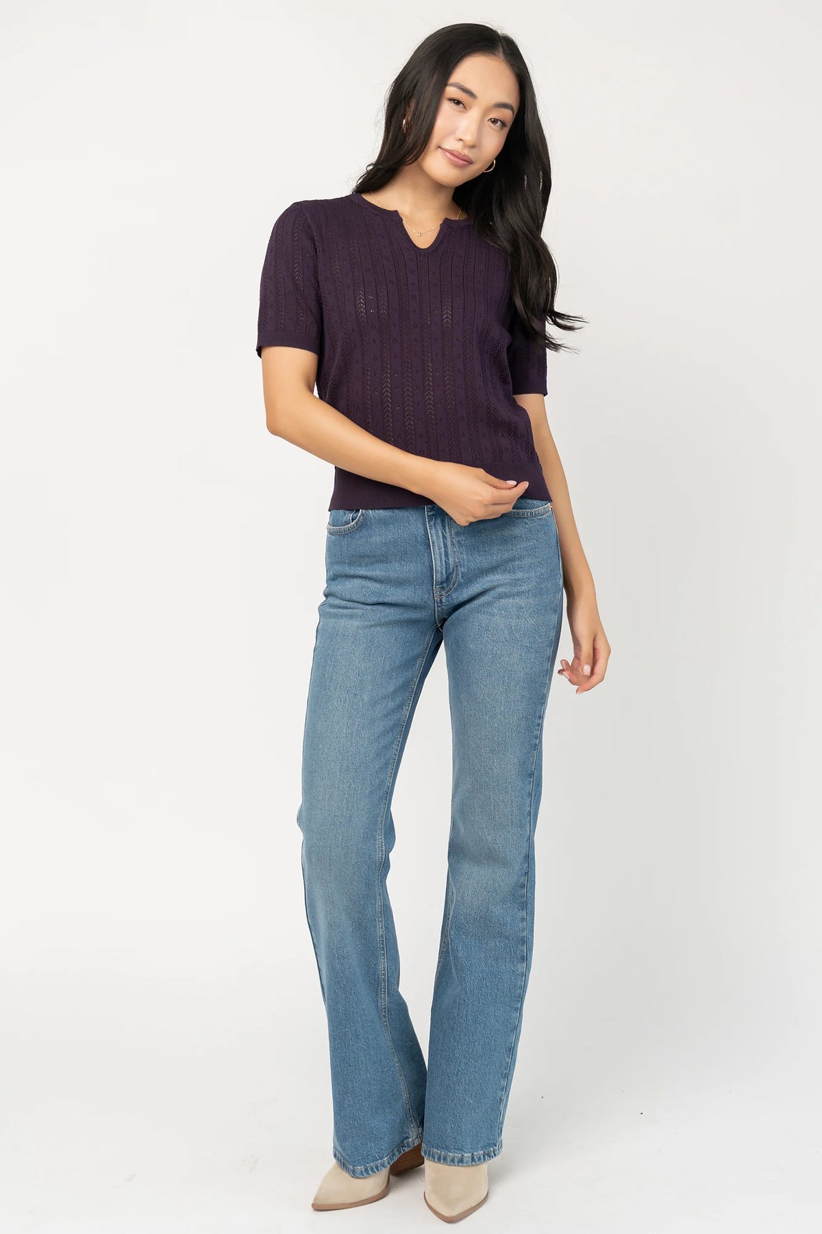 Perry Knit Top in Plum with pointelle texture, notched crew neckline, short sleeves, and ribbed hem and cuffs.