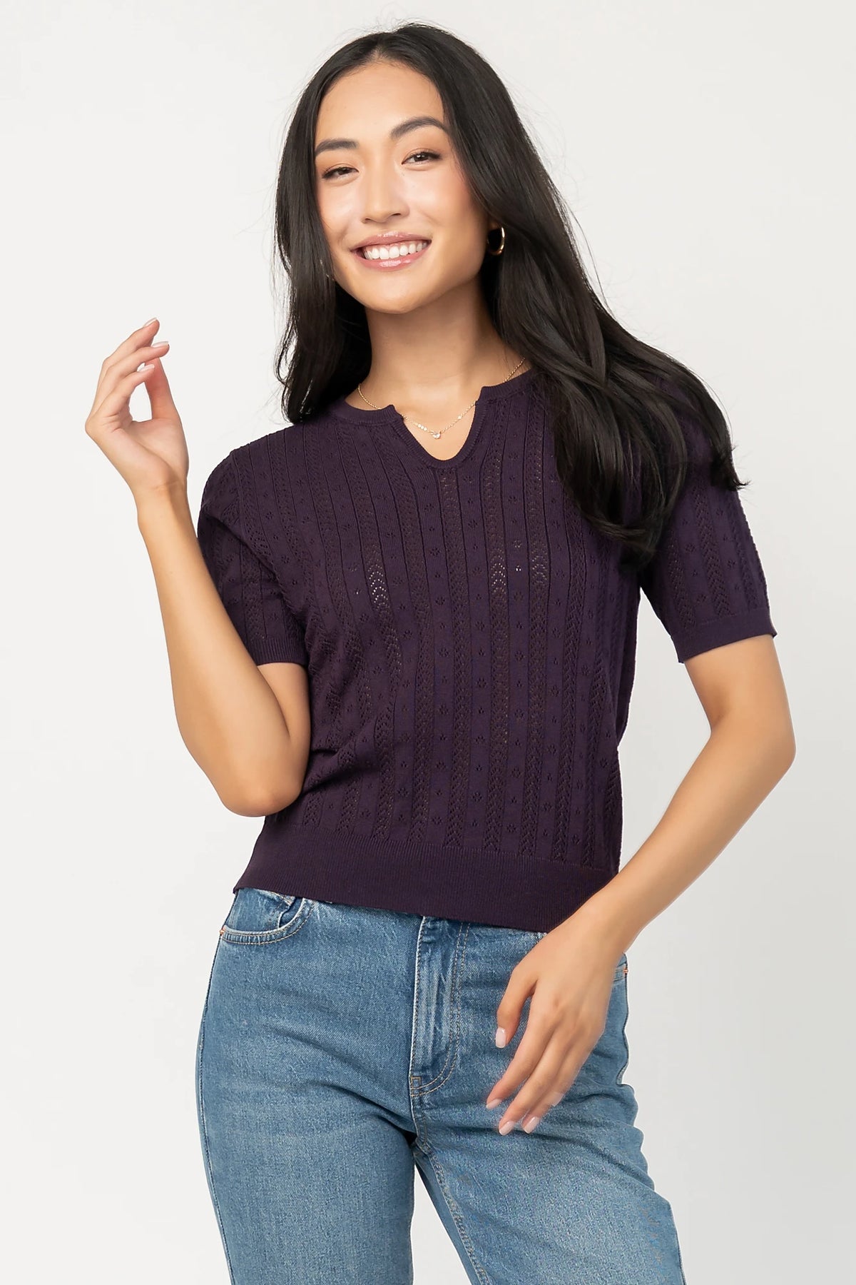 Perry Knit Top in Plum with pointelle texture, notched crew neckline, short sleeves, and ribbed hem and cuffs.