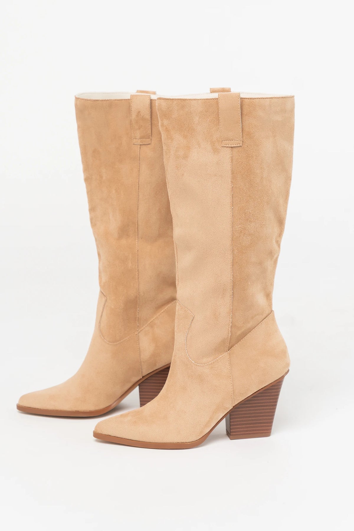 Wren Tall Western Boot in Beige with faux suede finish, pointed toe, angled stacked heel, and pull tab.