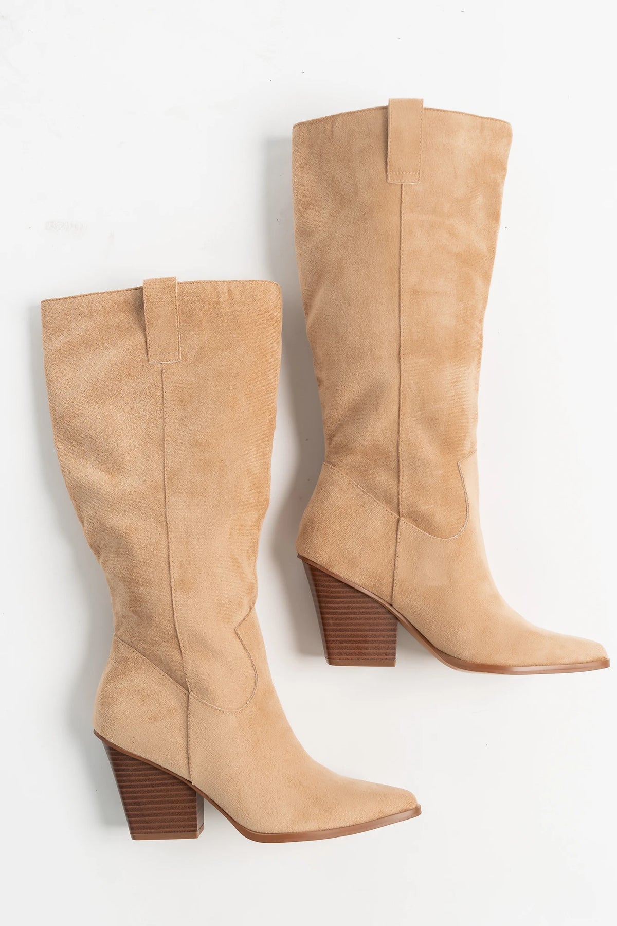 Wren Tall Western Boot in Beige with faux suede finish, pointed toe, angled stacked heel, and pull tab.