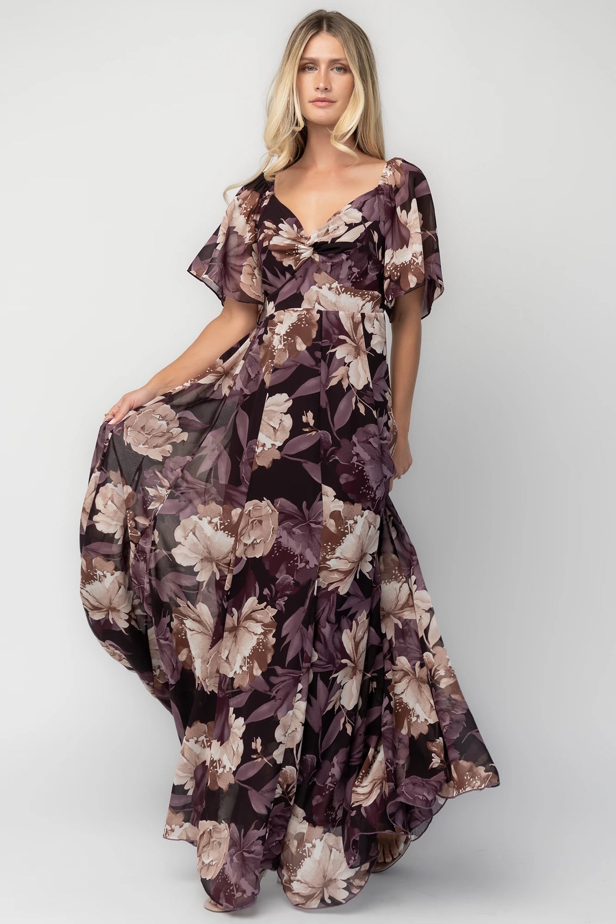 Positano Maxi Dress in Dusty Plum Floral with sweetheart neckline, flutter sleeves, smocked back, and tiered skirt.