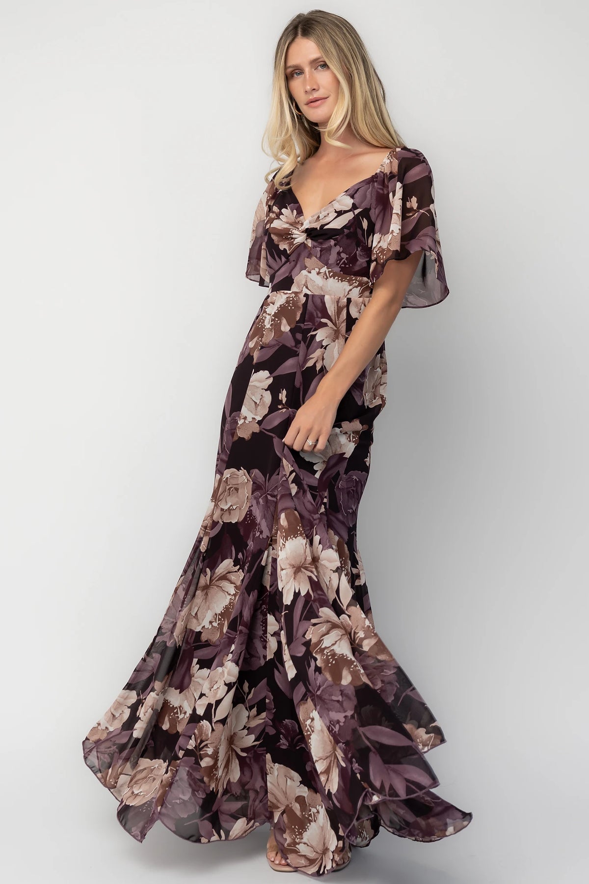Positano Maxi Dress in Dusty Plum Floral with sweetheart neckline, flutter sleeves, smocked back, and tiered skirt.