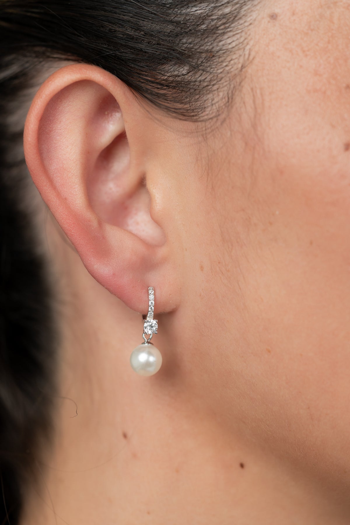 Isabella Pearl Hoop Earrings with cultured pearl accents and polished sterling silver hoops.