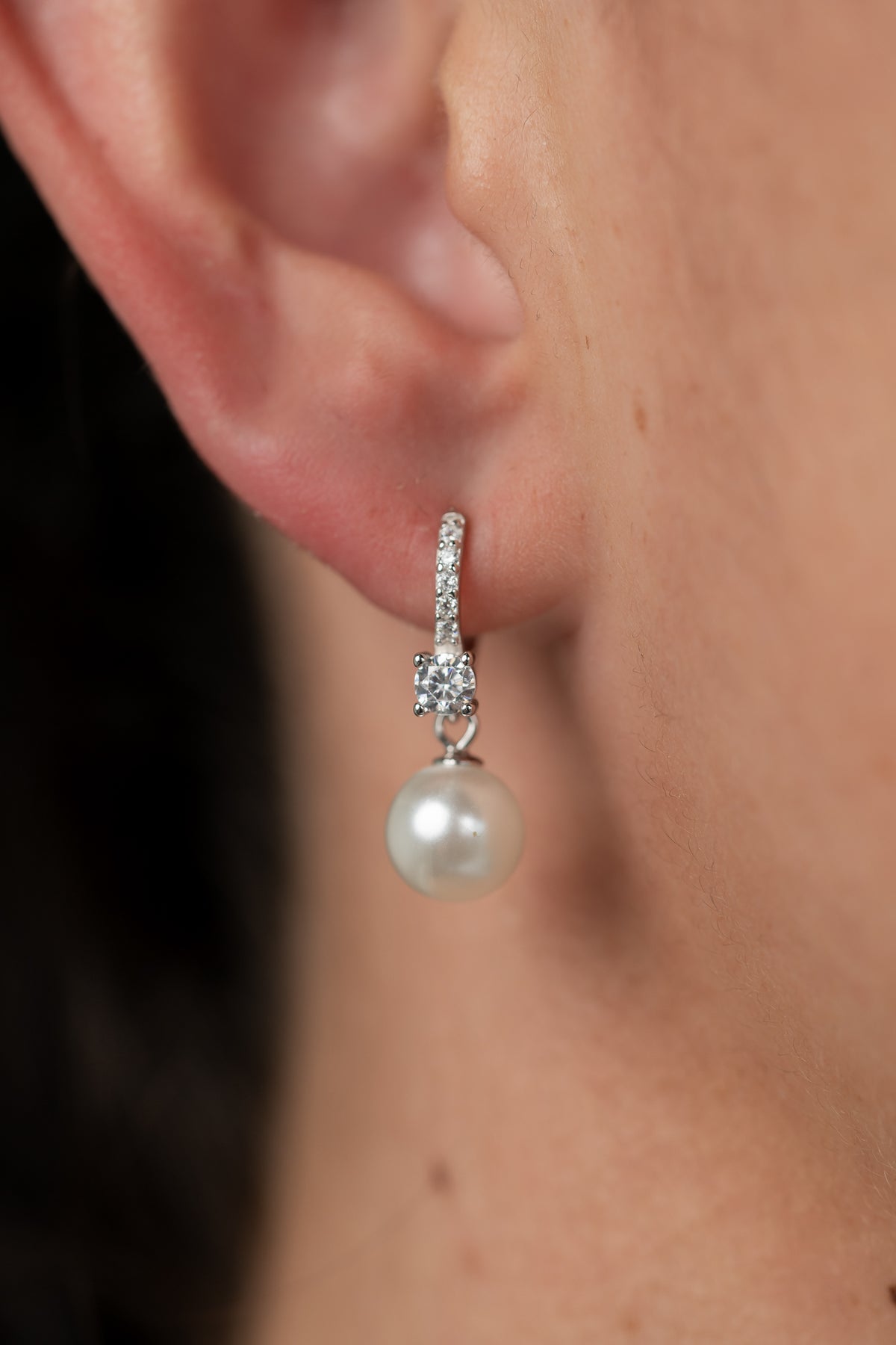 Isabella Pearl Hoop Earrings with cultured pearl accents and polished sterling silver hoops.
