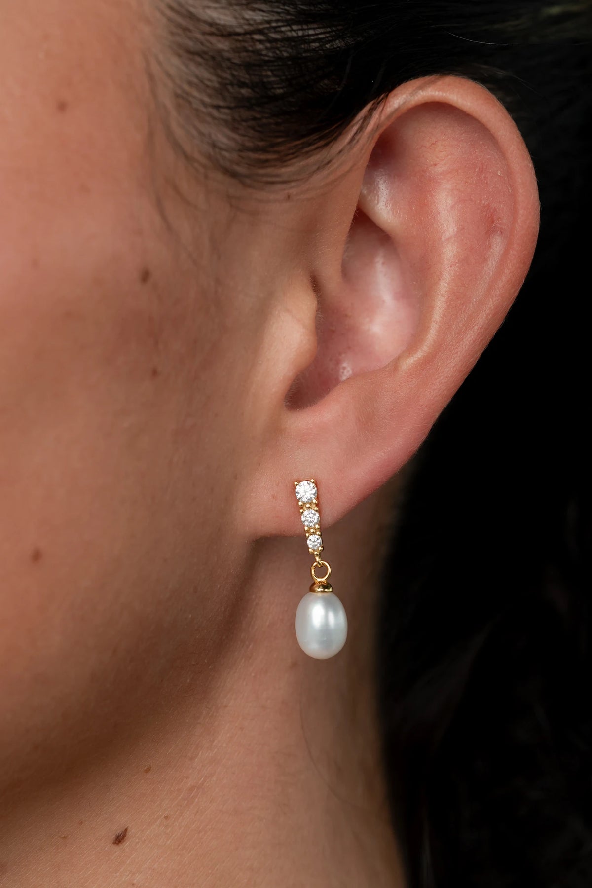 Romona Freshwater Pearl Earrings with luminous pearls and gold-finished sterling silver settings.