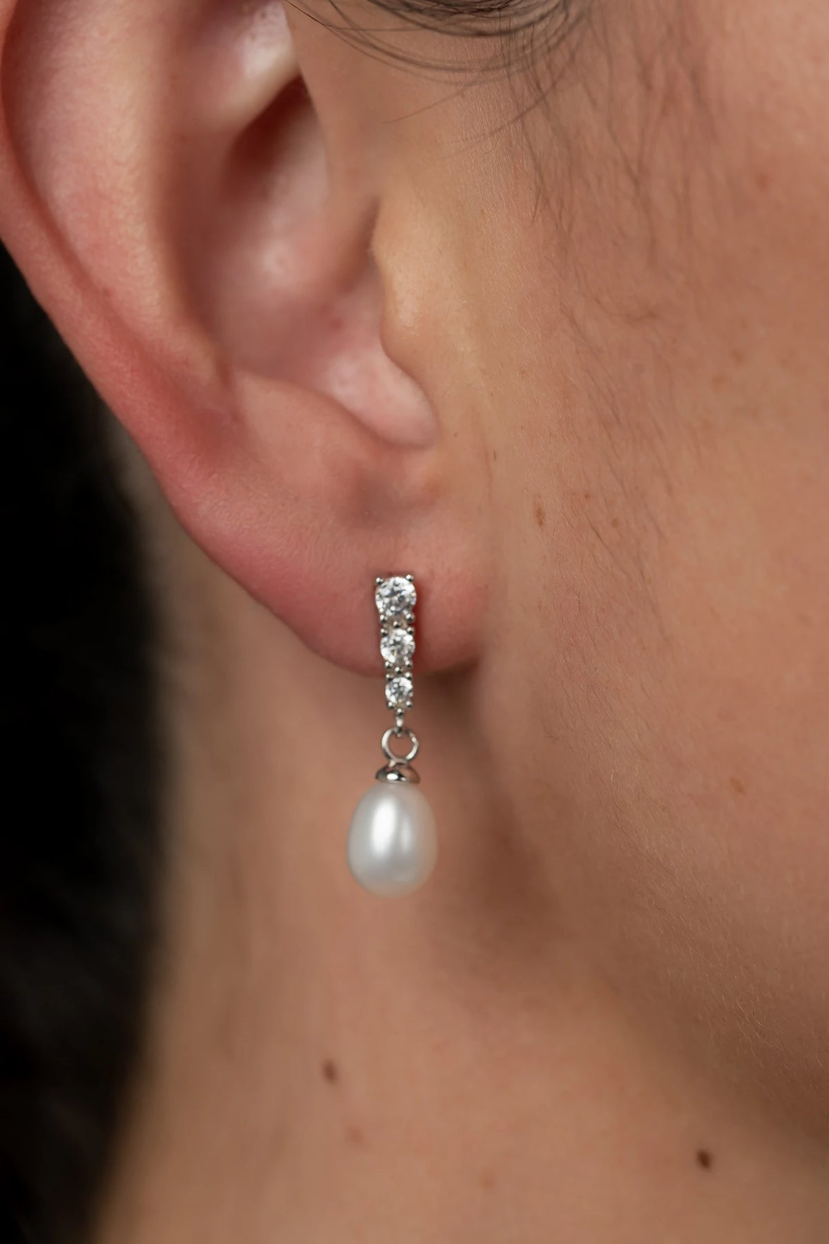Romona Freshwater Pearl Drop Earrings with luminous pearls and polished sterling silver settings.
