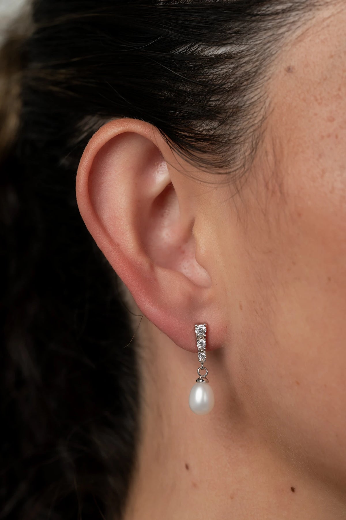 Romona Freshwater Pearl Drop Earrings with luminous pearls and polished sterling silver settings.