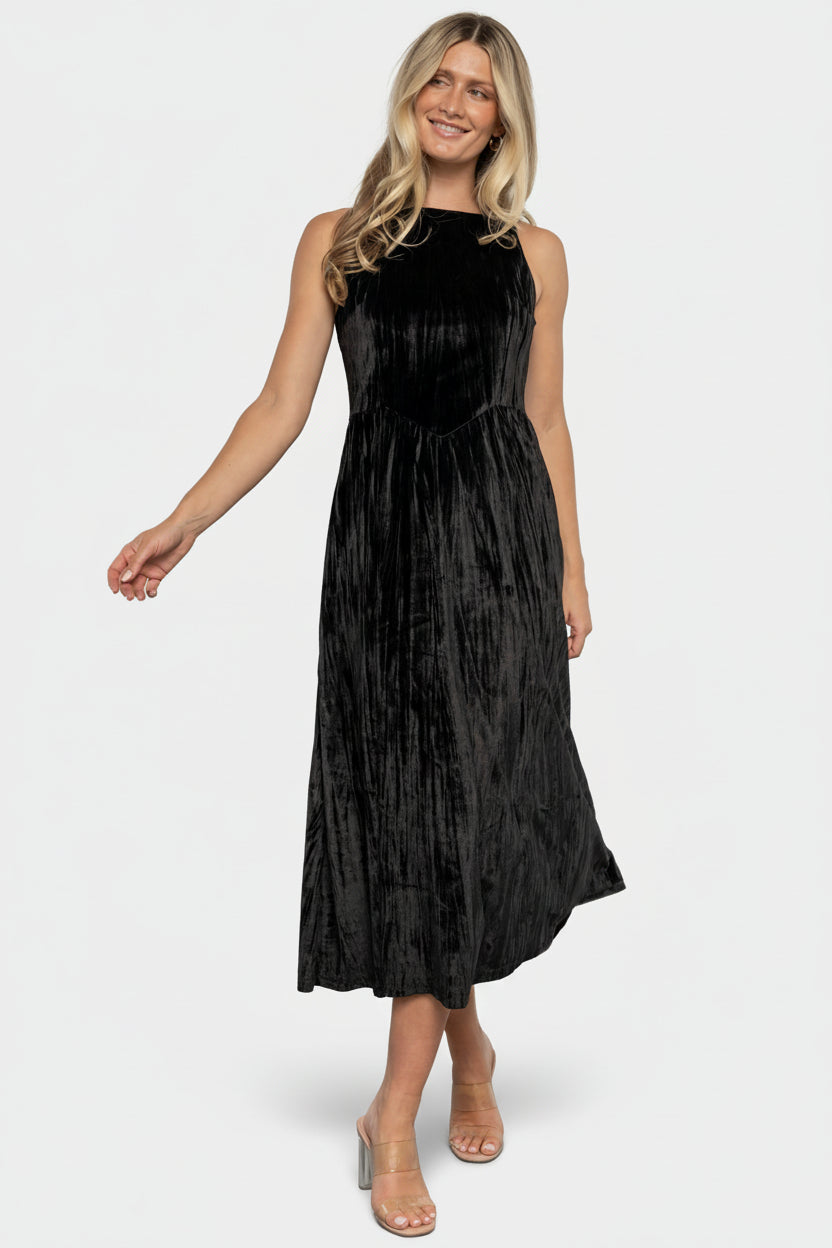Front view of black crinkled velvet midi dress with high square neckline and V-waistline.