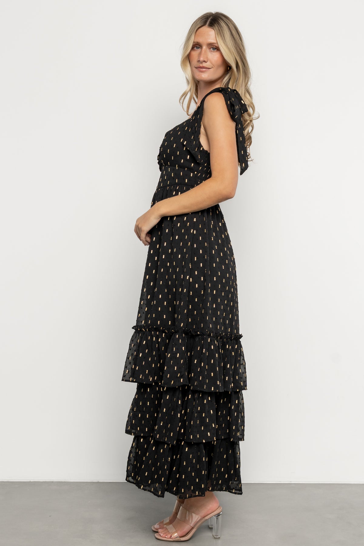 Adjustable self-tie straps, smocked back bodice, and gathered center-bust detail on Kassia Maxi Dress with ruffle tiers.