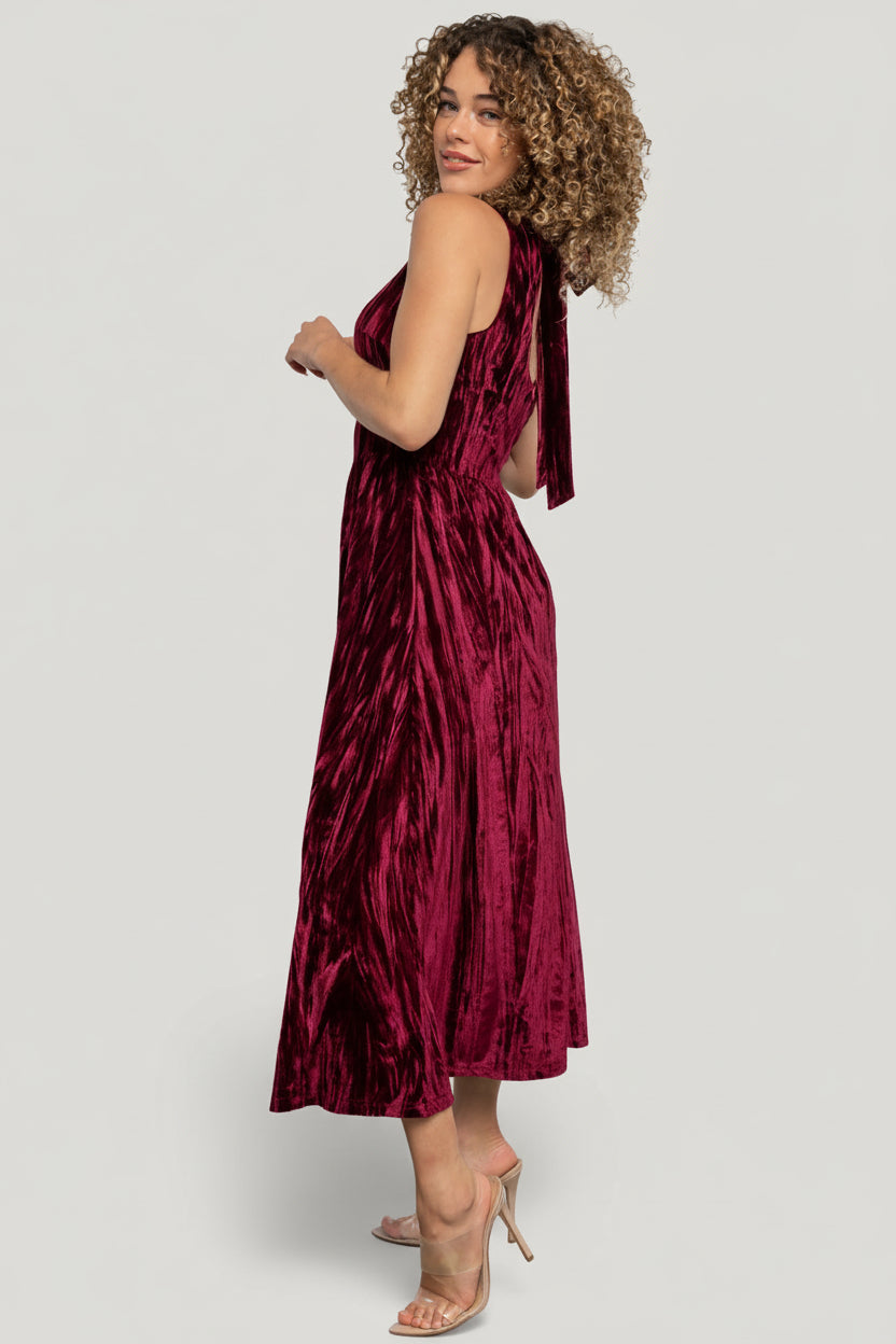 Back detail of Octavia Velvet Midi Dress in cranberry with round back neck, center back zipper and tie, and finished seamwork.