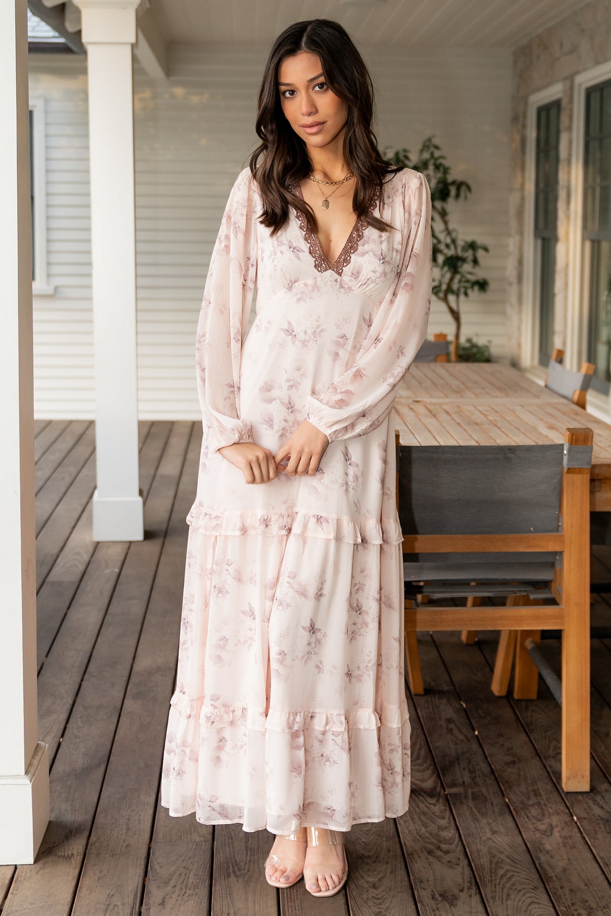 Studio detail shot of the dress fabric drape and sleeve cuff showing the lightweight chiffon layers and elastic sleeve finish.