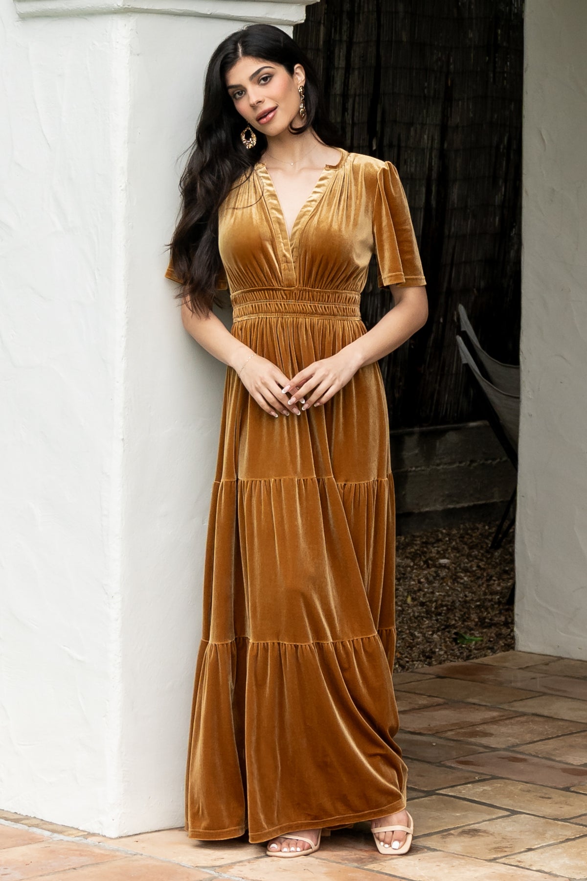 Studio close-up of velvet fabric and flutter sleeve on the Artemis Maxi Dress, emphasizing rich color, pile, and fine seam finishes for quality.