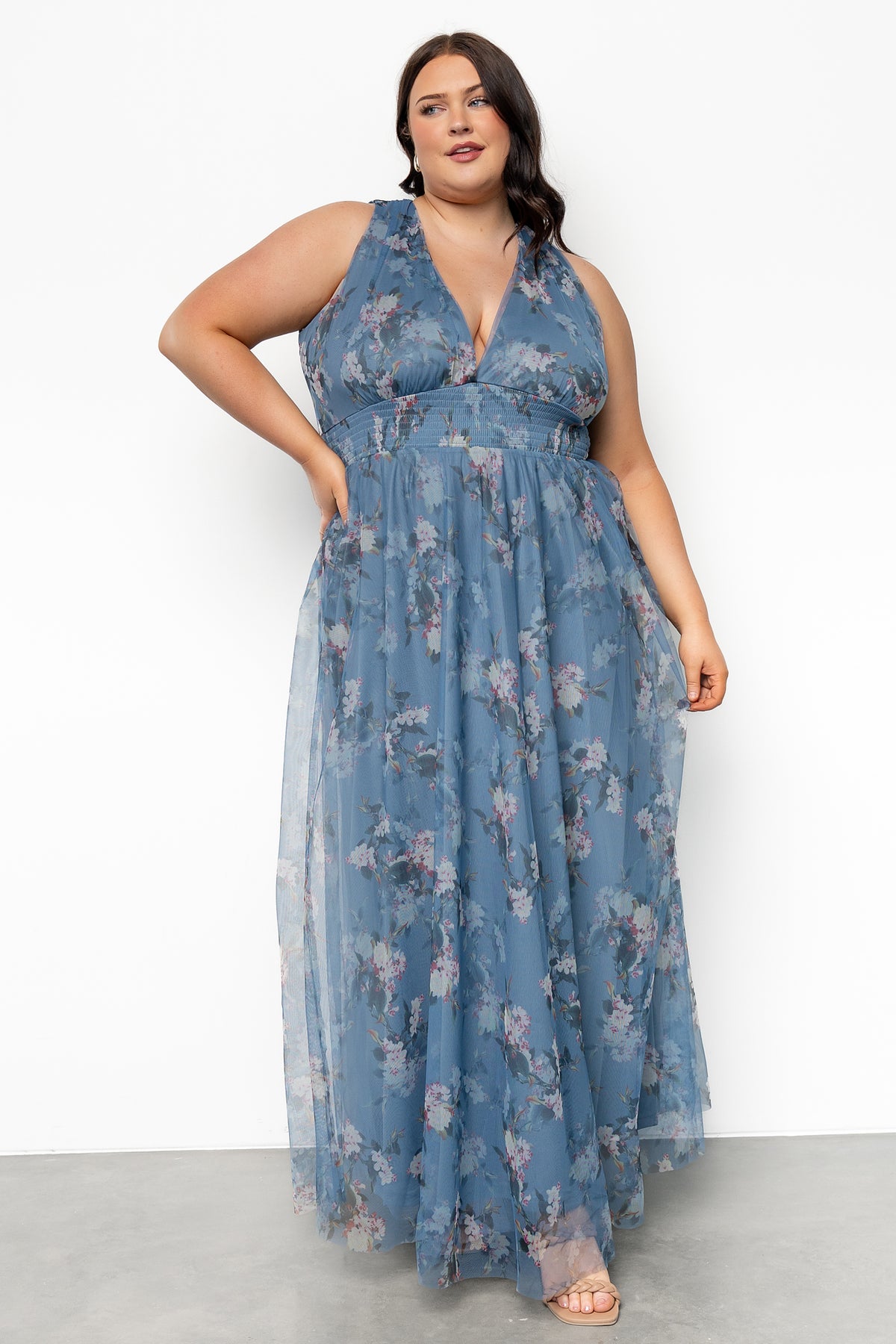 Full-length side profile of Kamila Tulle Maxi Dress in Blue Multi Floral highlighting layered tulle skirt, floral print, and tank sleeve silhouette.
