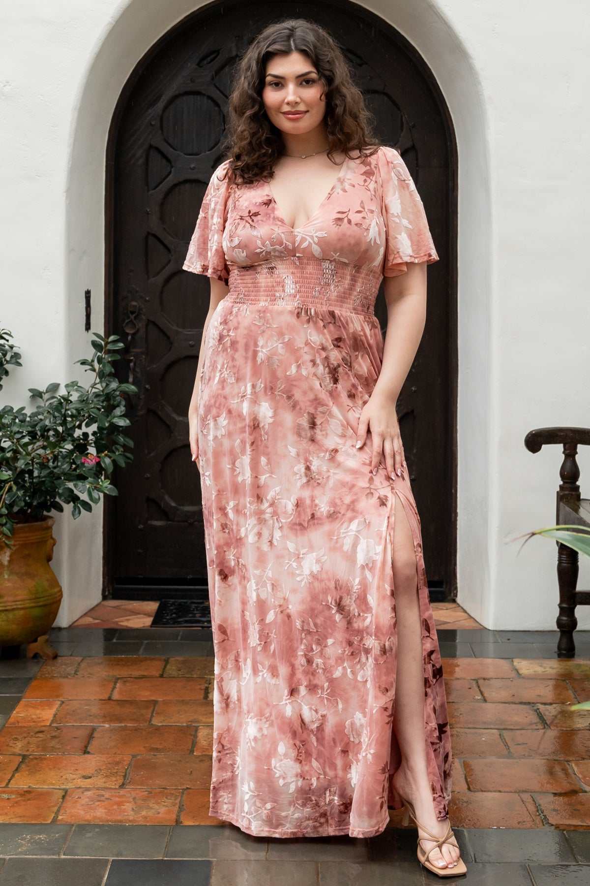Styled flat-lay image of Veronica Velvet Maxi Dress in blush highlighting embossed velvet fabric and construction details.