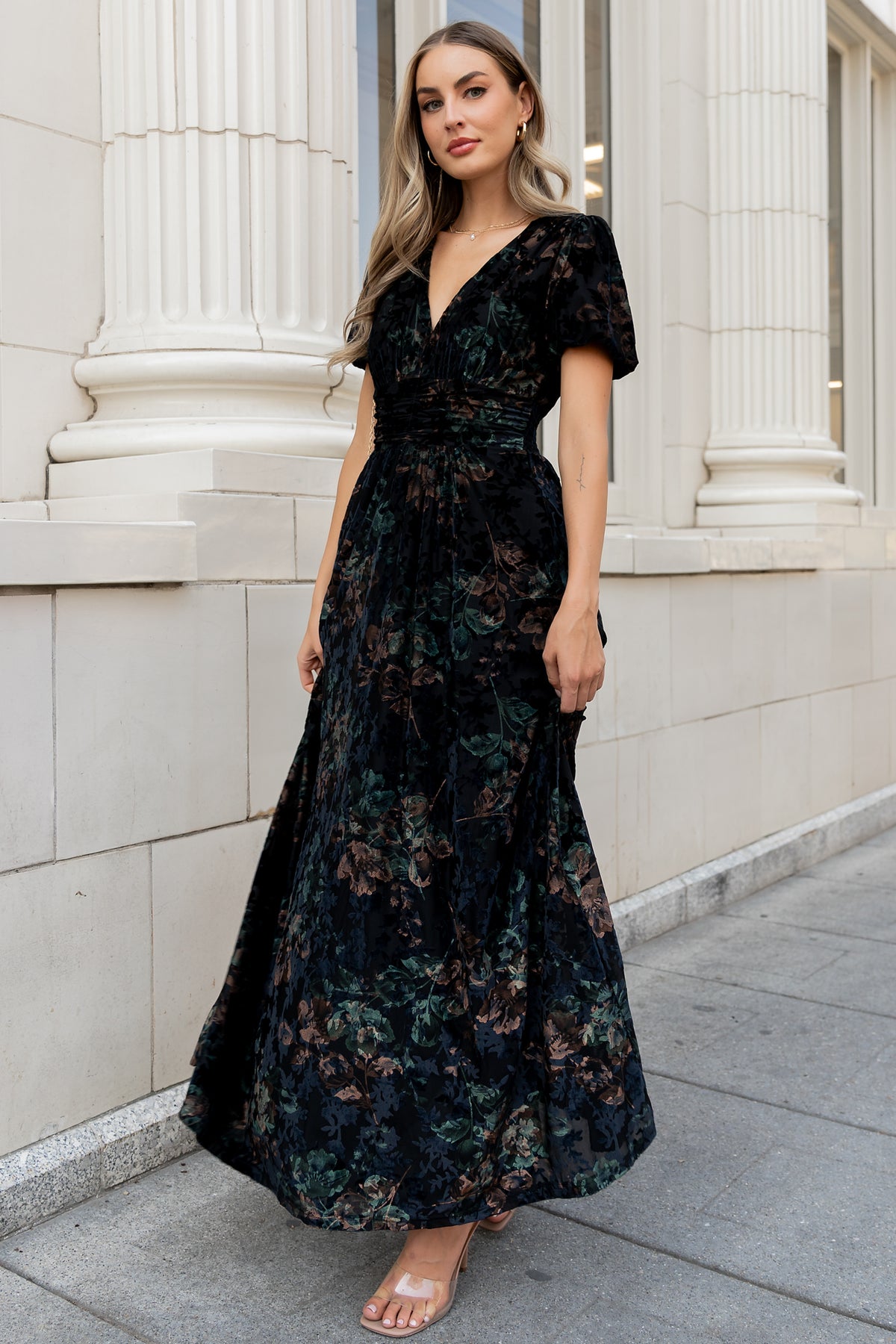 Detail shot of sleeve and waist gathering on the Leslie Velvet Maxi Dress; emphasizes puff sleeve elastic and gathered waist seam.