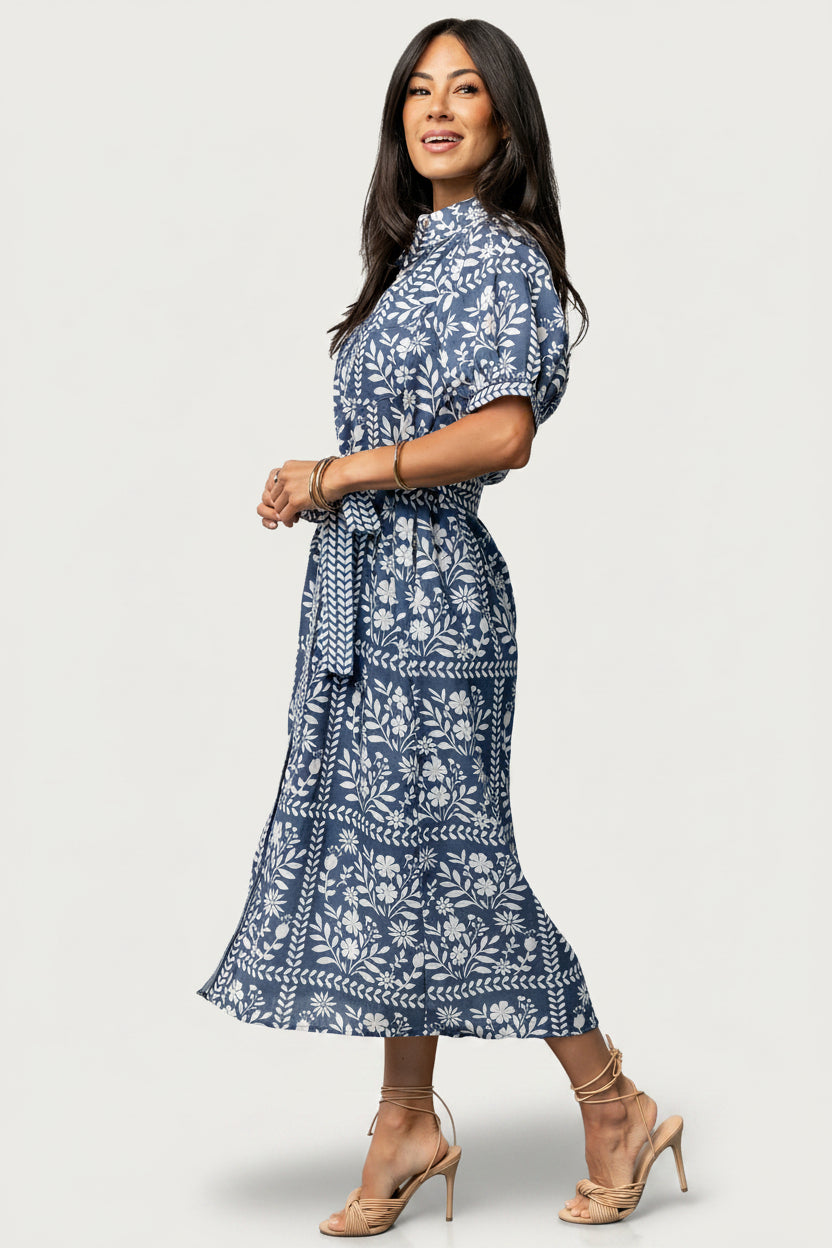 Close-up of button-front detail, textured fabric, and left bust pocket on the Karla dress, highlighting functional buttons and print.