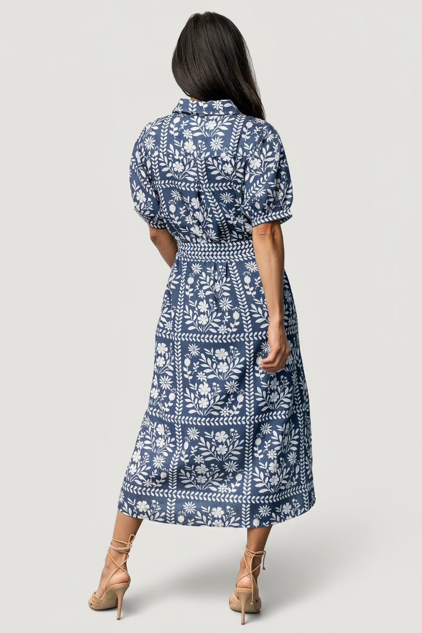 Model wearing Karla midi dress in deep slate with hidden side pockets visible and a soft drape through the skirt for casual styling.