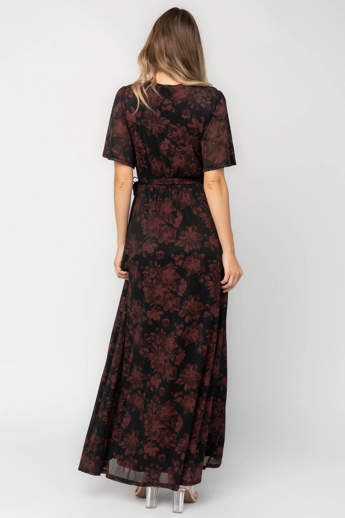 Reverie Maxi Dress in Black + Burgundy with floral print, surplice V-neck, sash waist, long sleeves, and side leg slit.