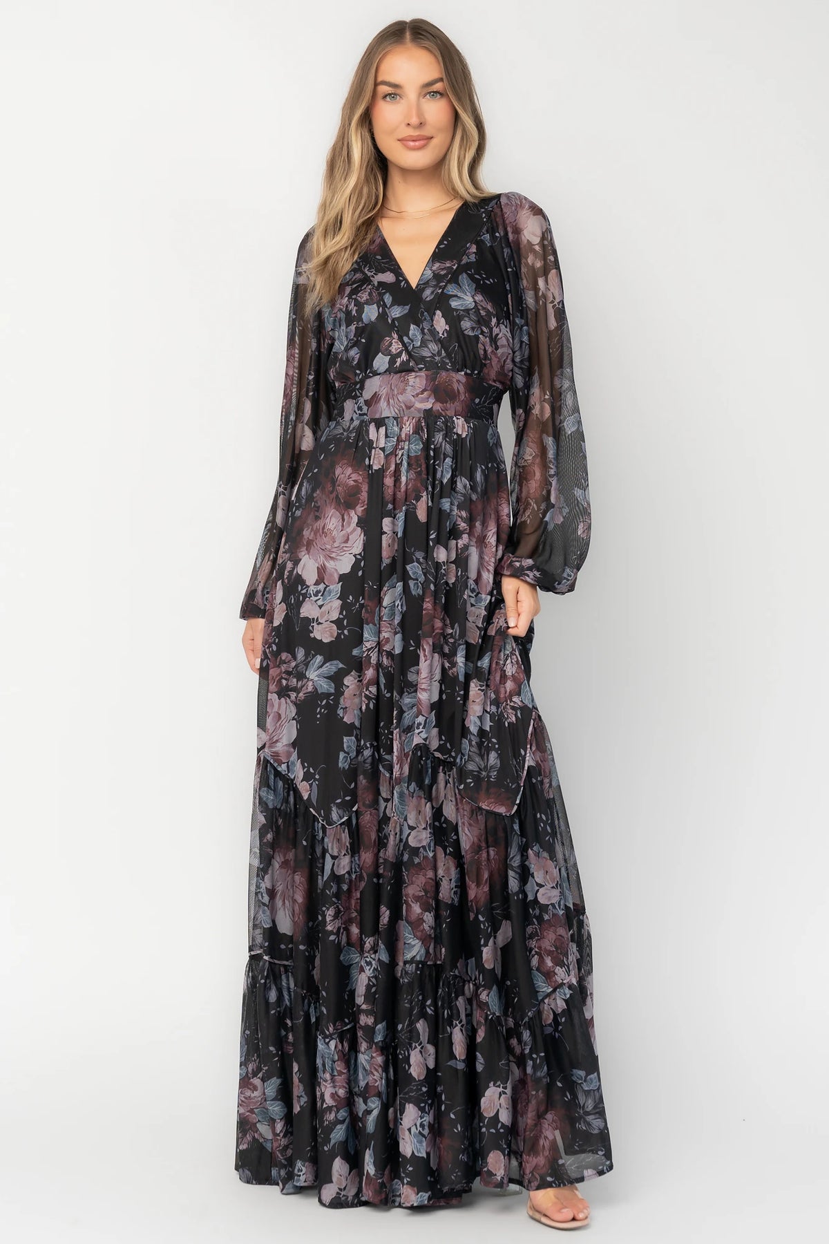 Rhiannon Maxi Dress in Midnight Floral with surplice V-neck, self-tie waist, sheer sleeves, and tiered mesh skirt.