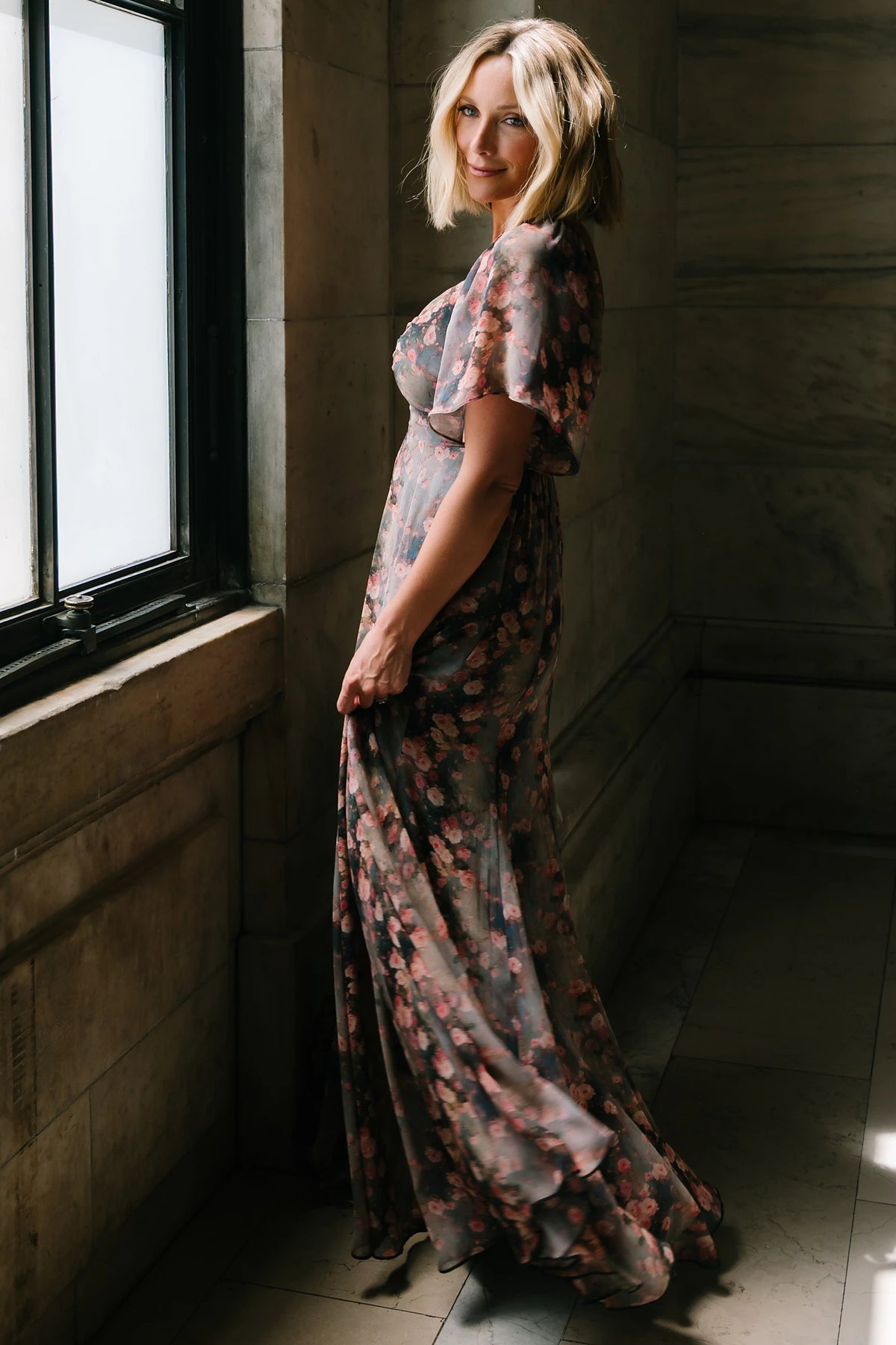 Positano Maxi Dress in Multi Floral with sweetheart neckline, flutter sleeves, smocked back, and flowy tiered skirt.