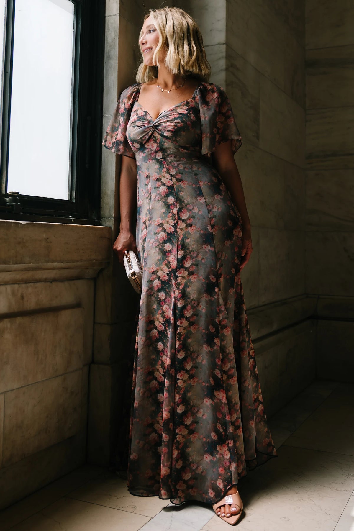 Positano Maxi Dress in Multi Floral with sweetheart neckline, flutter sleeves, smocked back, and flowy tiered skirt.