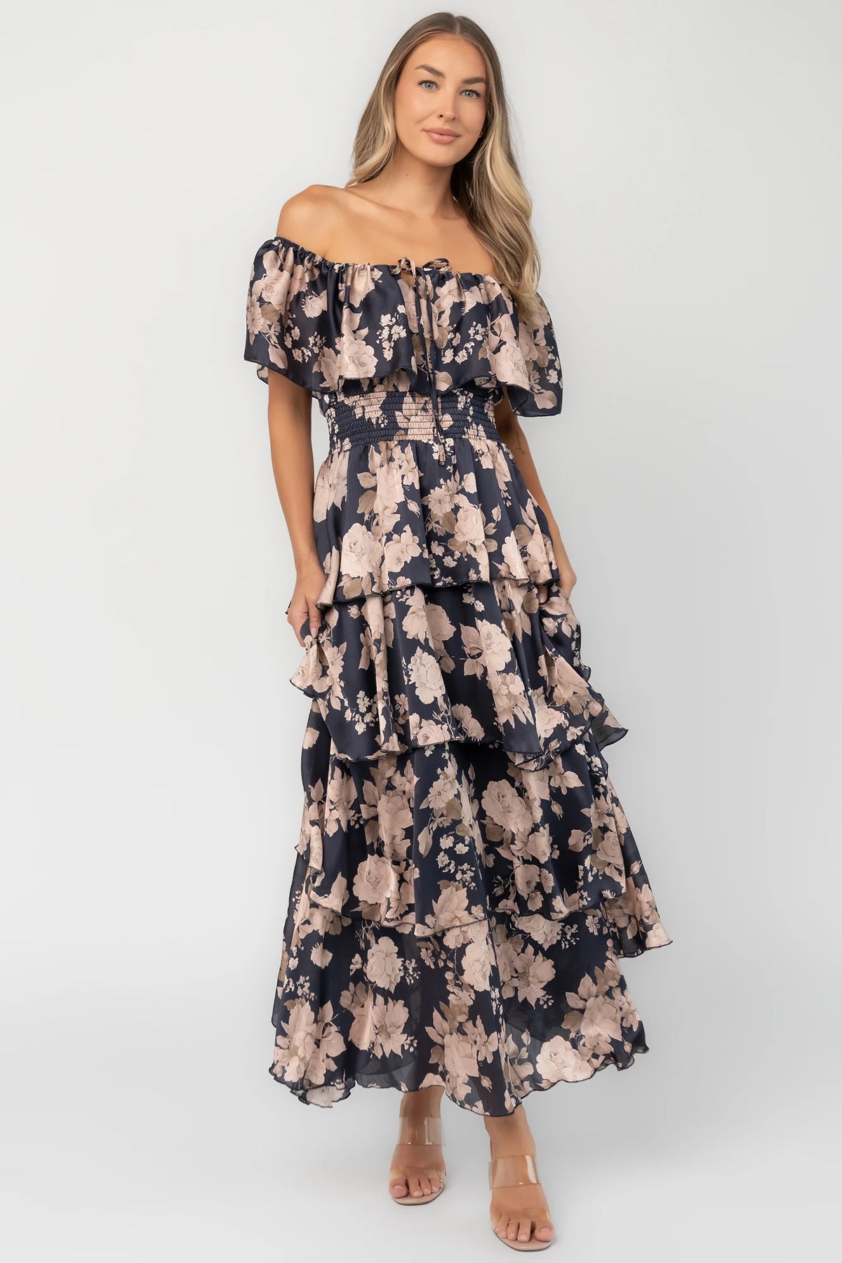 Isabelle Off Shoulder Maxi Dress in Multi Floral with elastic neckline, ruffle bust, smocked waist, and four-tiered skirt.