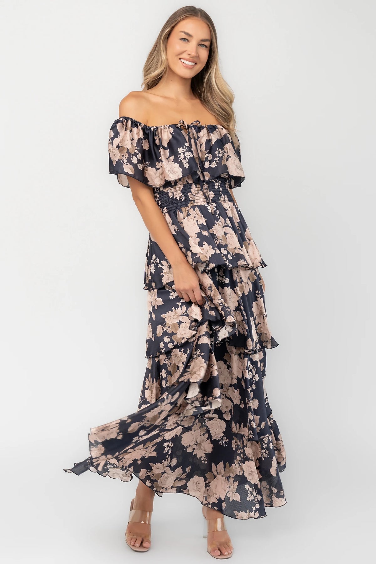 Isabelle Off Shoulder Maxi Dress in Multi Floral with elastic neckline, ruffle bust, smocked waist, and four-tiered skirt.