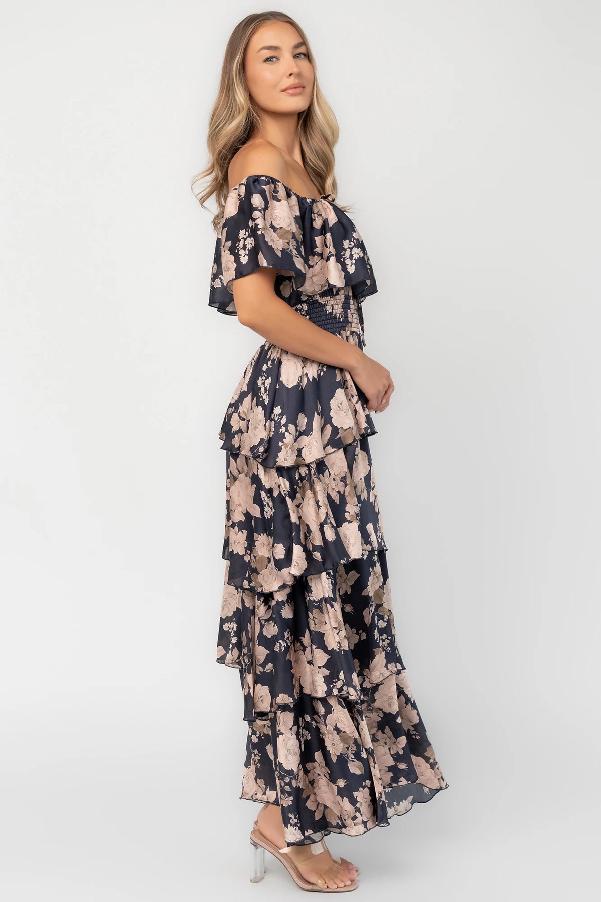 Isabelle Off Shoulder Maxi Dress in Multi Floral with elastic neckline, ruffle bust, smocked waist, and four-tiered skirt.