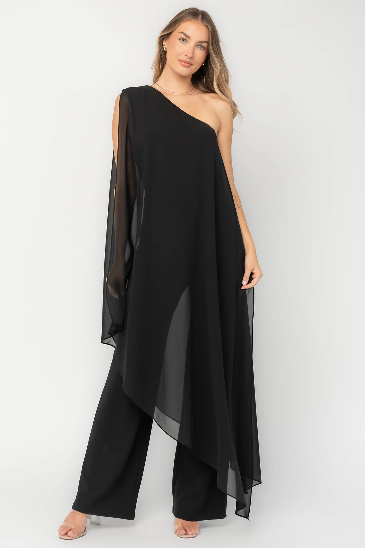 Penthouse One-Shoulder Jumpsuit in Black with asymmetric neckline, draped overlays, and flowing wide-leg silhouette.