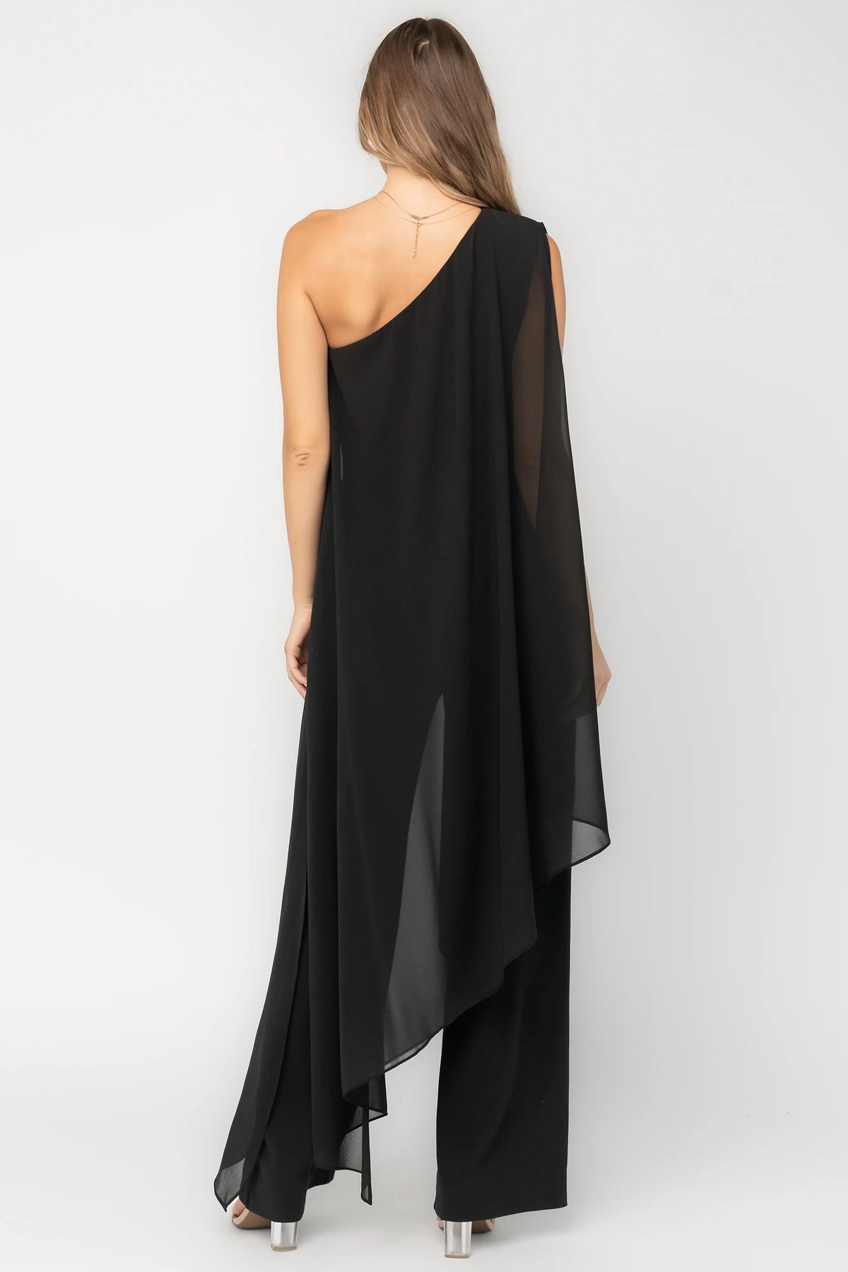 Penthouse One-Shoulder Jumpsuit in Black with asymmetric neckline, draped overlays, and flowing wide-leg silhouette.