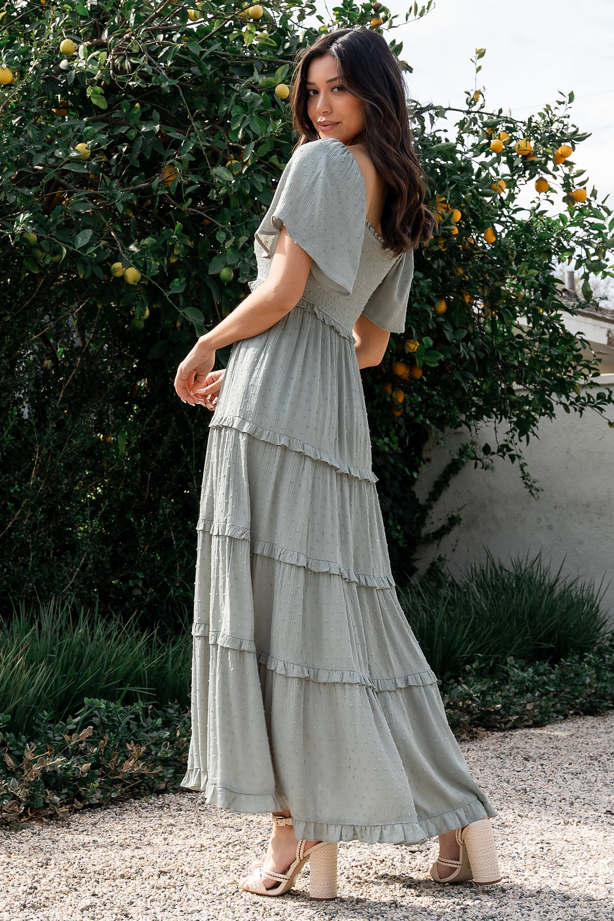 Close-up of smocked bodice and elastic square neckline on the Lenora dotted rayon dress, highlighting stitch detail and subtle dot pattern.