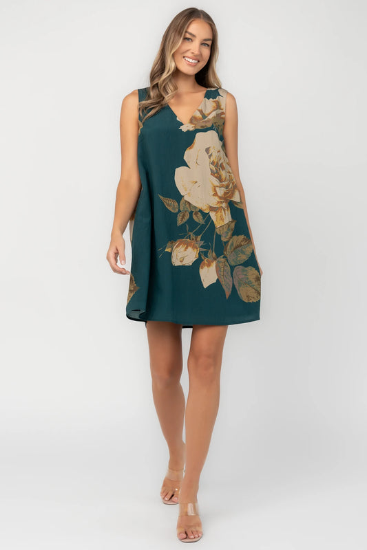 Deep topaz floral shift dress with a V-neckline, sleeveless silhouette, side pockets, and a relaxed above-the-knee fit.