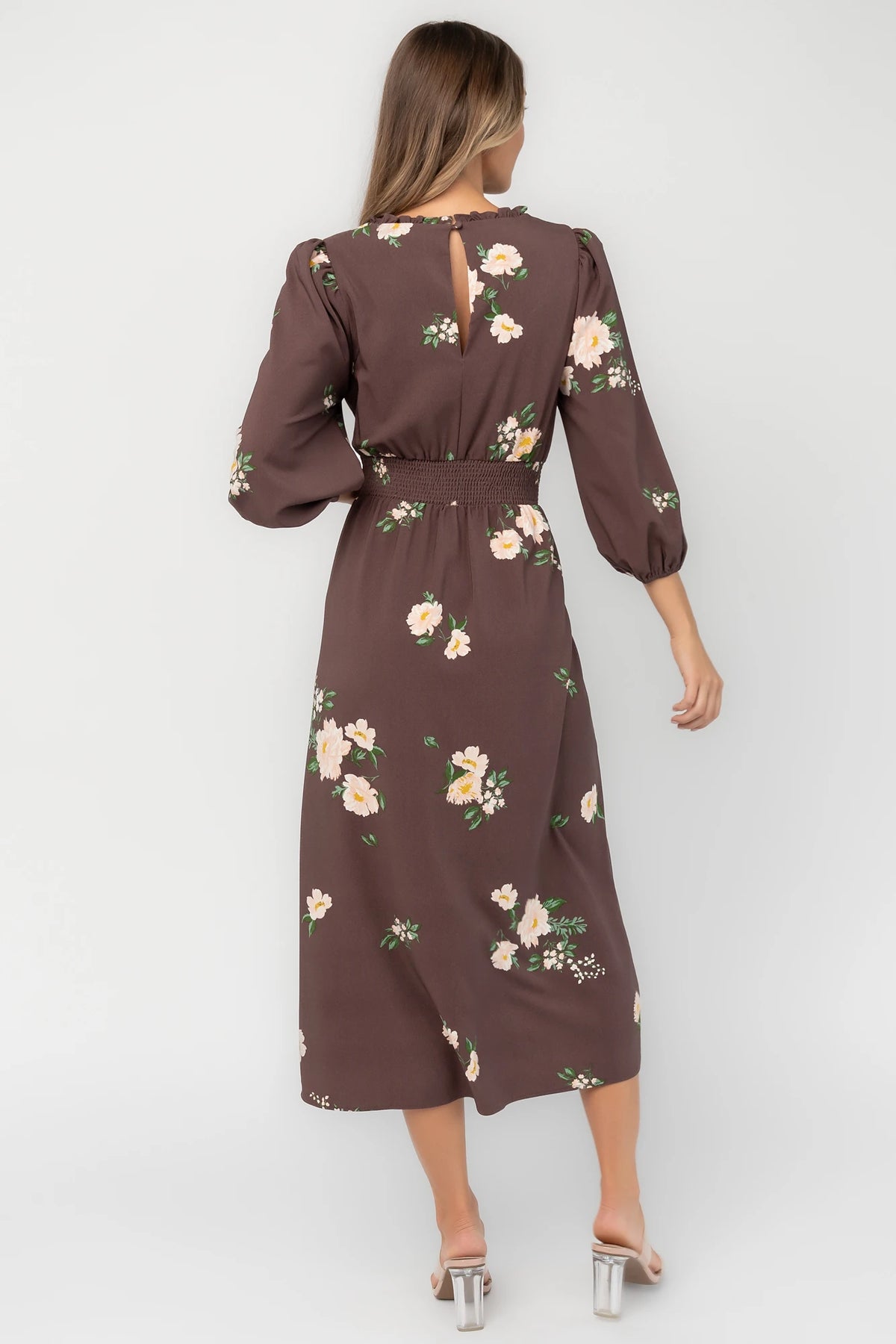 Clove floral chiffon maxi dress with a ruffled mock neckline, mid-length sleeves, smocked back waist, and flowing full-length skirt.