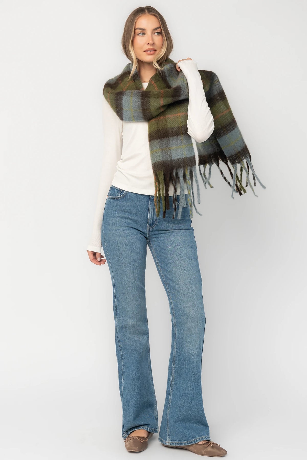 Maison Oversized Scarf with sage green, soft blue and neutral plaid, brushed texture, and fringe trim.