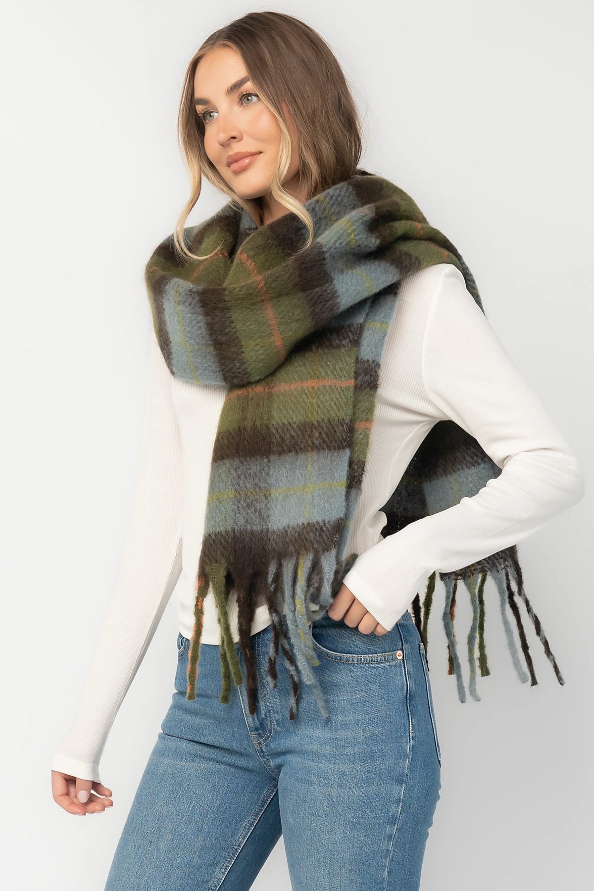 Maison Oversized Scarf with sage green, soft blue and neutral plaid, brushed texture, and fringe trim.