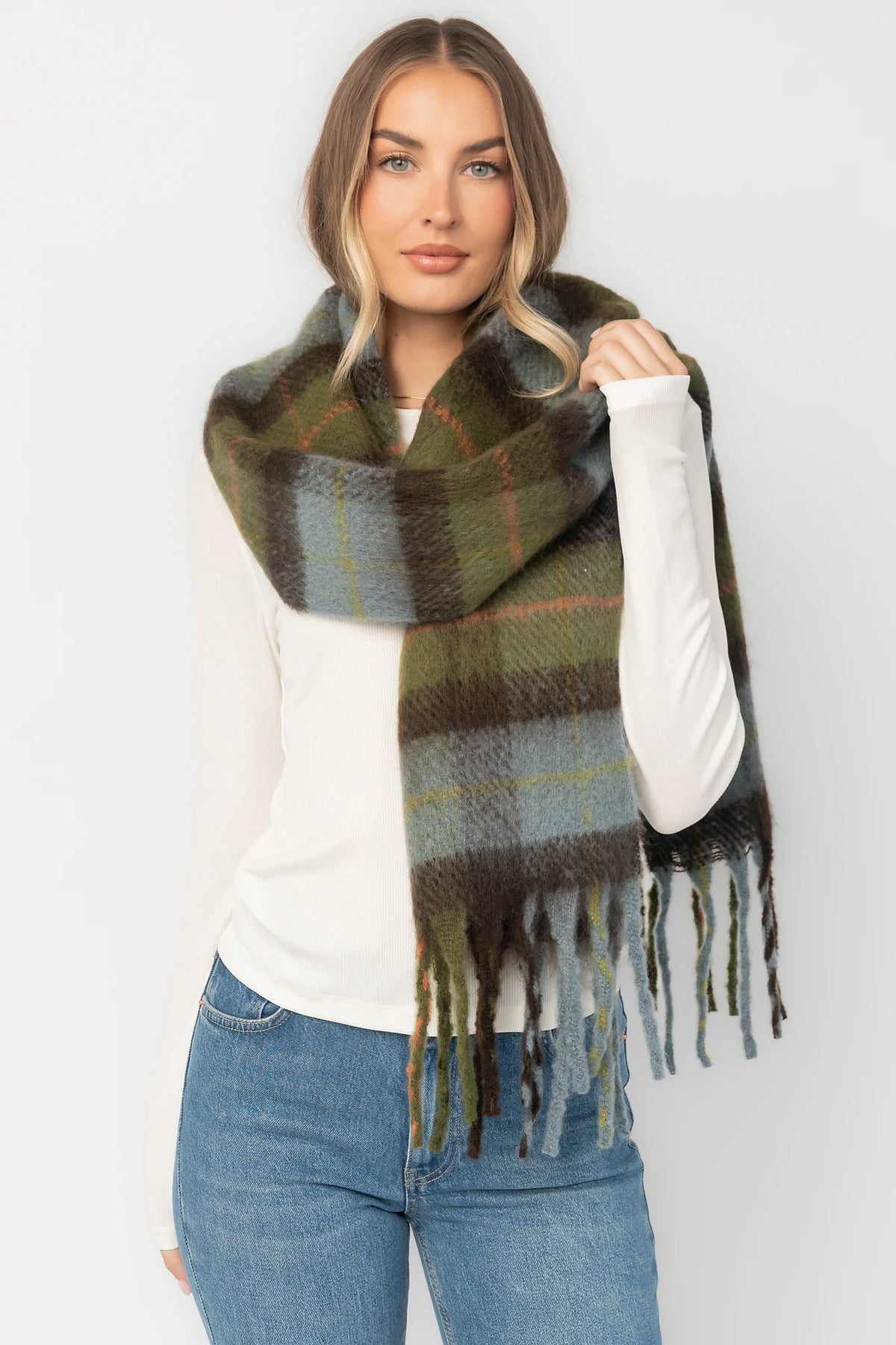 Maison Oversized Scarf with sage green, soft blue and neutral plaid, brushed texture, and fringe trim.