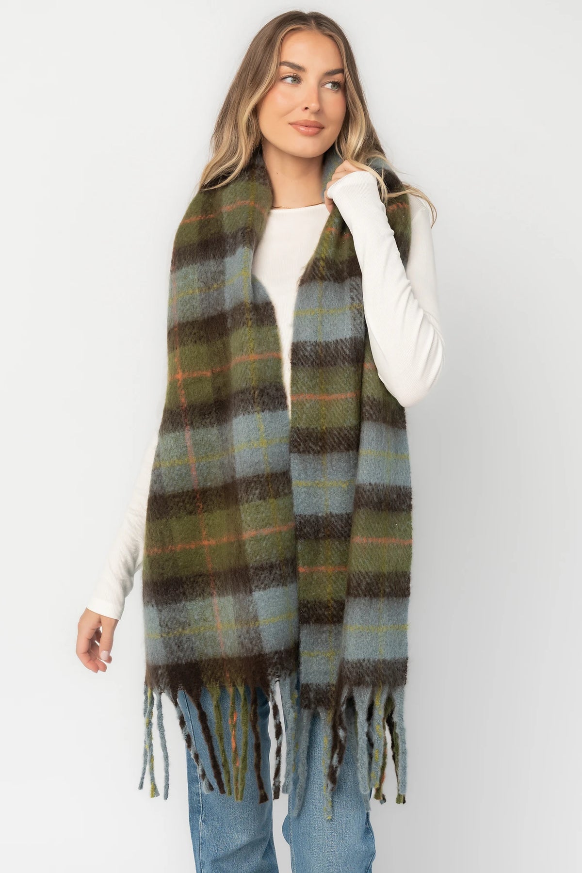 Maison Oversized Scarf with sage green, soft blue and neutral plaid, brushed texture, and fringe trim.