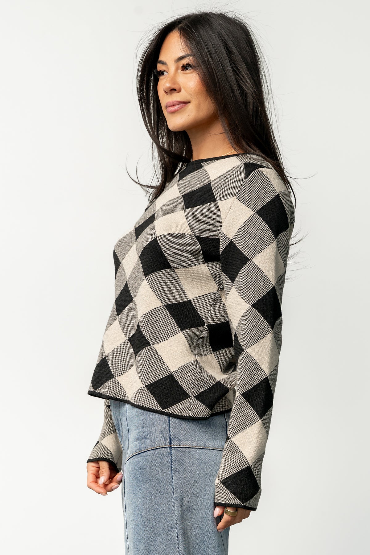 Model wearing Linnea sweater styled with high-rise wide leg jeans, demonstrating casual pairing and transitional-season outfit options.