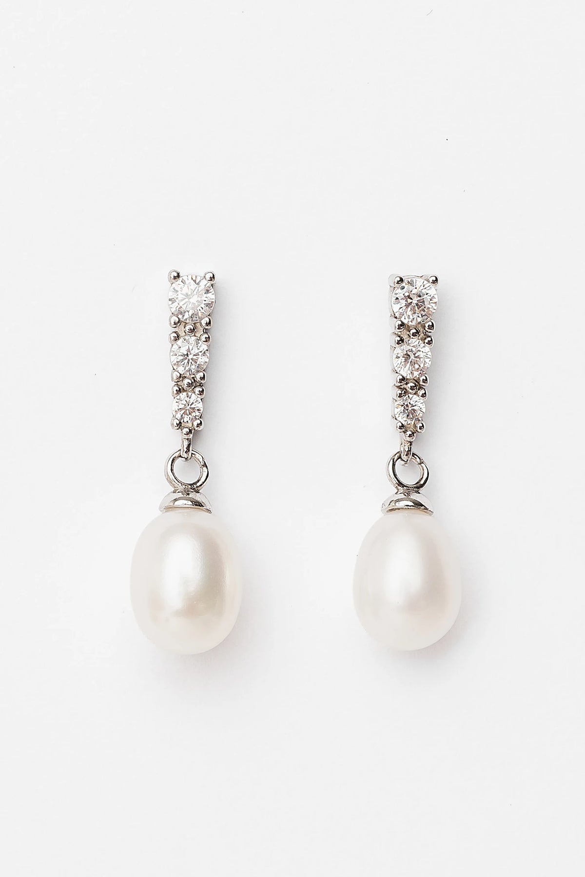 Romona Freshwater Pearl Drop Earrings with luminous pearls and polished sterling silver settings.