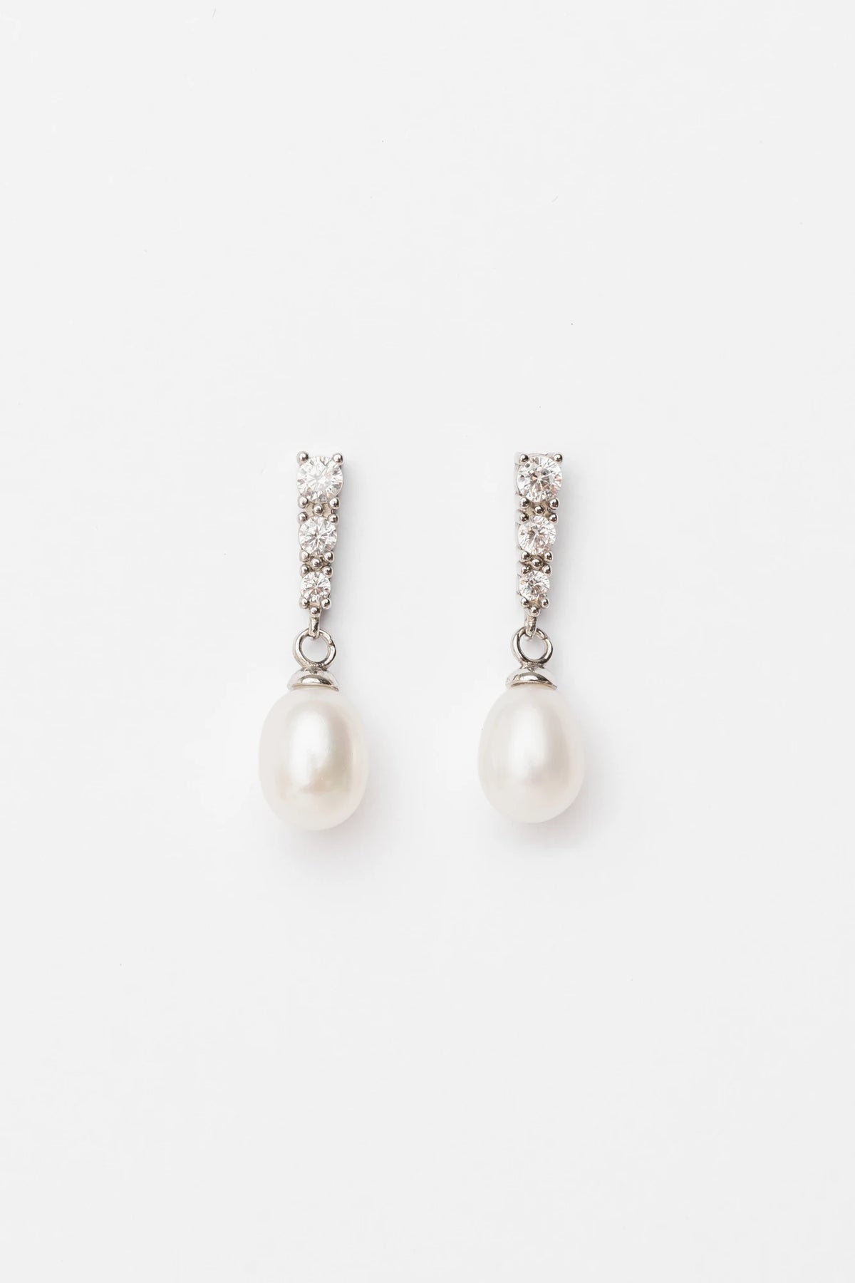 Romona Freshwater Pearl Drop Earrings with luminous pearls and polished sterling silver settings.
