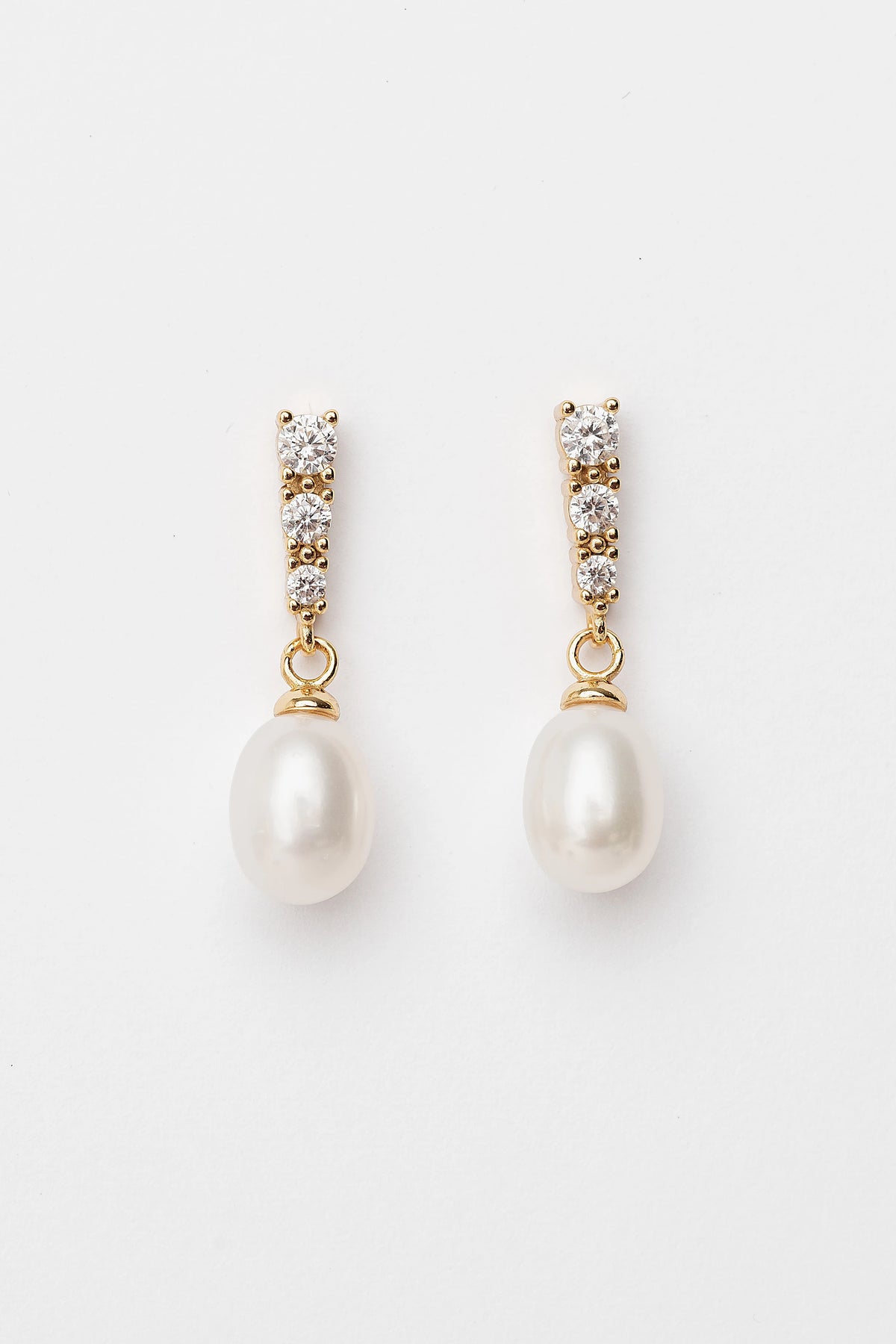Romona Freshwater Pearl Earrings with luminous pearls and gold-finished sterling silver settings.