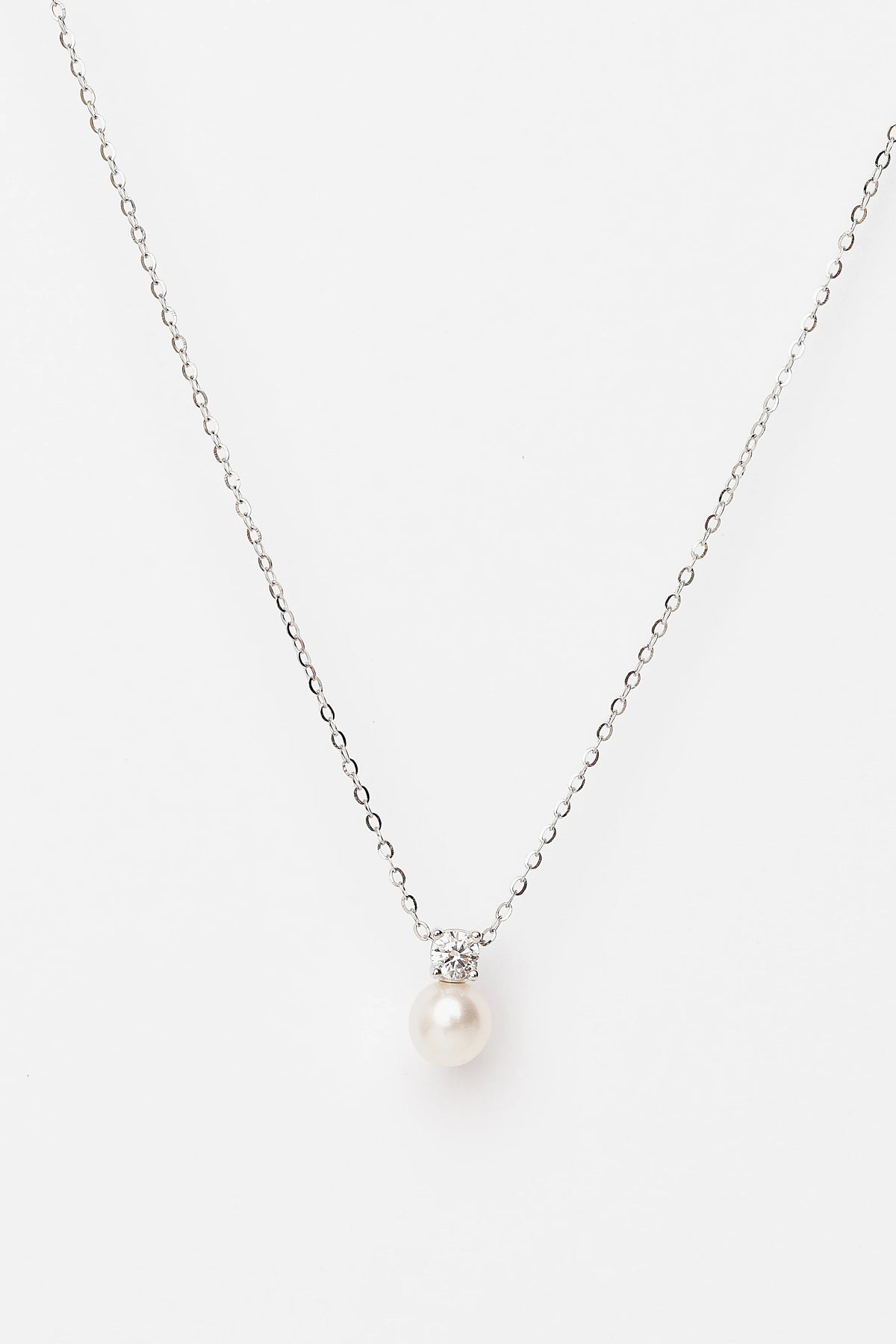 Addilyn Pearl Necklace in Silver with freshwater pearl pendant, moissanite accent, and delicate silver-tone chain.