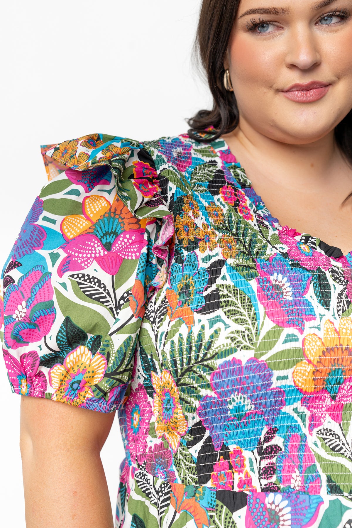Flat-lay image of Kyrie Puff Sleeve Short Dress White Multi showing pattern repeat, ruffled V-neckline, and smocked bodice construction.