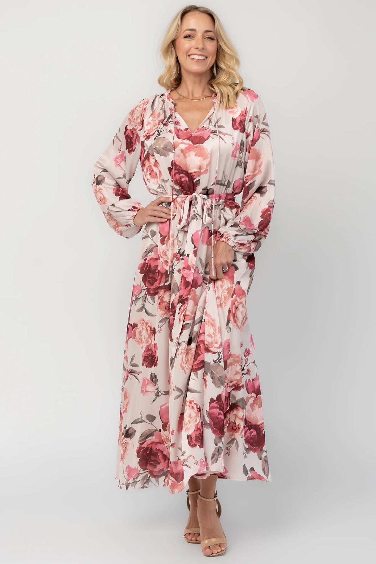Rose floral maxi dress with a split V-neckline, ruffle-trimmed collar, long balloon sleeves, removable self-tie belt, and a flowing maxi skirt.